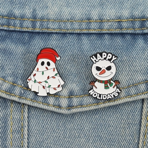 Christmas ghost and snowman enamel pins set with festive lights on denim background