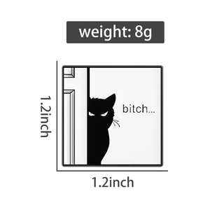 Macro detail of square black cat enamel pin with bitch text and 1.2 inch dimensions