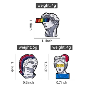 Detailed view of creative enamel pins with classical sculpture designs and rainbow motifs