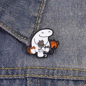 Cute cartoon Flork enamel pin featuring a cat lover holding multiple kittens on denim