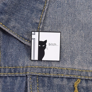 Funny black cat peeking out enamel pin with witty text on denim fabric background