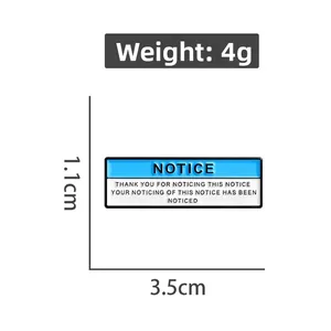 Blue NOTICE enamel pin badge dimensions showing 3.5cm length and 4g weight detail