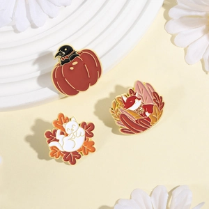 Autumn enamel brooch set featuring cat, fox, and crow on maple leaves and pumpkin