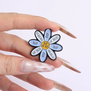 Funny Daisy enamel pin with Nap Or Not text and humorous life quotes in hand view