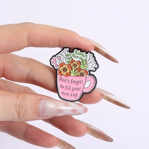 Pink enamel cup pin with flowers and Don't forget to fill your own cup slogan