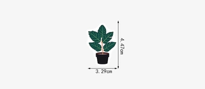 Detail view showing dimensions of green potted plant sticker 4.47cm by 3.29cm size