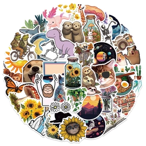 Close-up of 50 assorted stickers featuring cute animals, floral and cosmic art designs