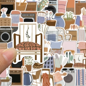 Hand holding a Nordic style cartoon home sticker from a 50-piece decorative set