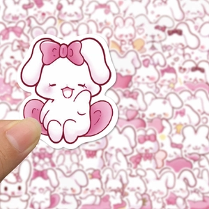 Close-up of a cute white rabbit sticker with a pink bow for laptop and phone decor