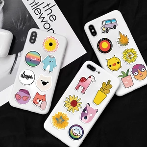 Creative cartoon stickers displayed as decorations on white smartphone cases