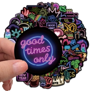 Close-up of waterproof neon PVC stickers with cyberpunk designs for laptops and water bottles