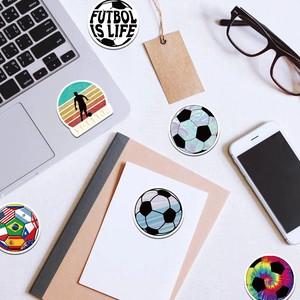 Vibrant football graffiti stickers collection displayed on a laptop and stationery