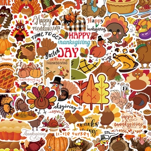 Macro shot of colorful Thanksgiving stickers featuring turkeys, pumpkins and maple leaves