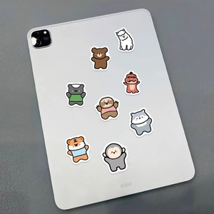 Detail of cute animal stickers on a tablet including brown bear and tiger designs