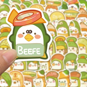 Detail shot of a cute waterproof penguin food sticker with PVC texture for DIY decorating