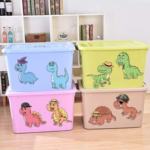 Detail view of colorful plastic storage boxes with cartoon dinosaur stickers and lids