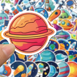 Close-up showing a cartoon orange Saturn sticker with high-quality white die-cut borders