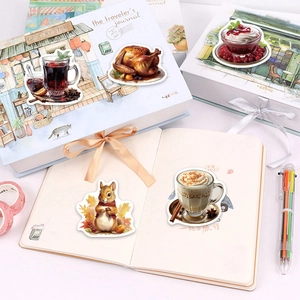 Macro shot of cozy Thanksgiving stickers with coffee and squirrel patterns on a journal