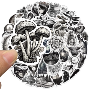Close-up of black and white nature stickers featuring mushroom designs and scenery
