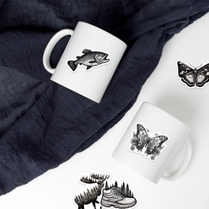 60 monochrome nature stickers with forest and animal motifs applied on white ceramic mug