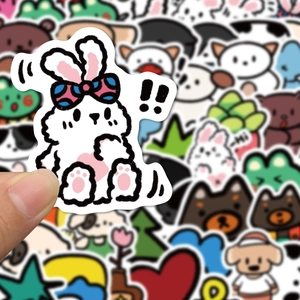 Close-up of cute cartoon animal stickers featuring rabbits and bears for journals
