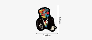 Detailed size view of a surrealist puzzle head man sticker measuring 6.06cm by 5.09cm