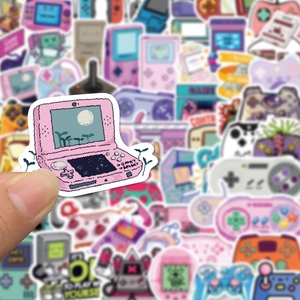 Detailed close-up of a retro pink pixel handheld console sticker with glossy finish