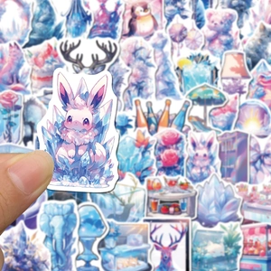Close-up of hand holding a waterproof ice world graffiti sticker with pastel colors
