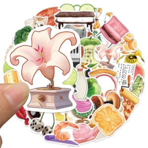 Macro detail of waterproof creative stickers showing pizza and floral gramophone patterns