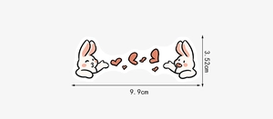 Detail view of cartoon rabbit sticker with heart motifs and precise size measurements