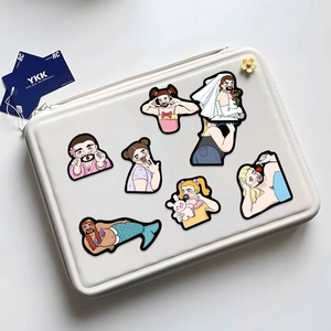 Detail of creative cartoon beard man stickers on a white laptop sleeve surface