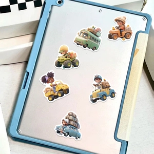 Detail of travel themed waterproof stickers on a light blue tablet with matte finish