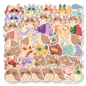 Flat lay of diverse waterproof cartoon owl stickers with cute expressions and colorful designs