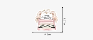 Pink typewriter sticker with flowers and future bestselling author text, 5.5cm size