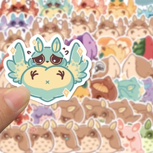 Close-up of a mint green owl monster sticker with heart-shaped body and white border