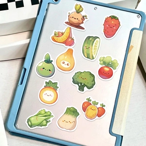 Close-up of cute cartoon fruit and vegetable stickers on a blue tablet cover