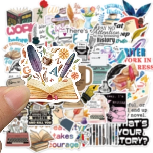 Close-up of hand holding a vintage typewriter sticker from the literary collection