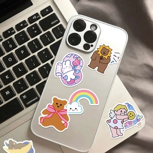Cute cartoon animal stickers on a white smartphone featuring a rabbit and bear designs