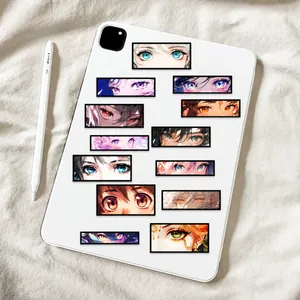 Close-up of anime eye stickers applied to a white tablet back with a stylus beside