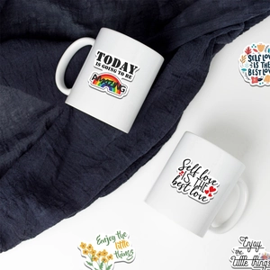 Close-up of white ceramic mugs with Today is going to be amazing inspirational quotes