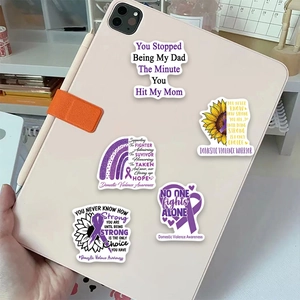 Domestic violence awareness stickers featuring purple ribbons on a tablet back
