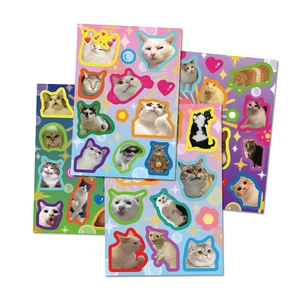 Close-up of DIY funny cat meme stickers for scrapbooking and journal decoration