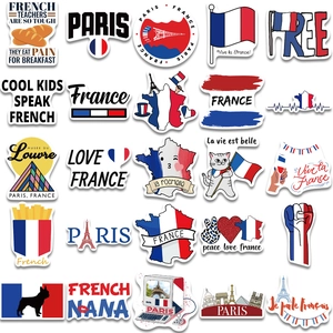 Flat lay of 25 waterproof French travel stickers featuring Eiffel Tower and Paris icons