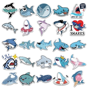 Flat lay of 25 cartoon shark stickers with various funny designs for DIY luggage deco