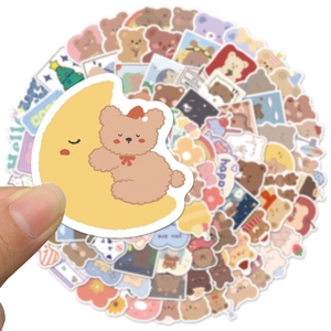 Close-up of cute cartoon bear stickers with Korean style aesthetic for journaling