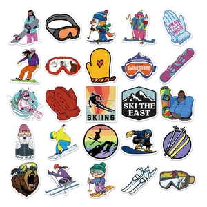 Flat lay of 25 waterproof ski stickers featuring goggles, mountains, and winter animals