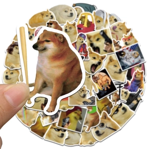Close-up of waterproof Doge meme stickers featuring baseball bat and astronaut designs