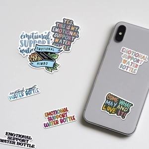 Waterproof vinyl stickers on a phone back featuring emotional support quotes and illustrations