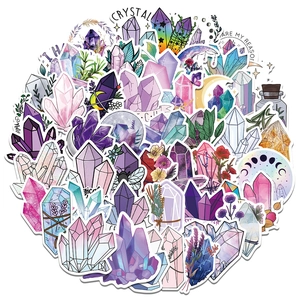 Flat lay of watercolor dream crystal stickers with purple and blue mineral patterns