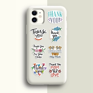Close-up of assorted Thank You stickers displayed on a white smartphone case